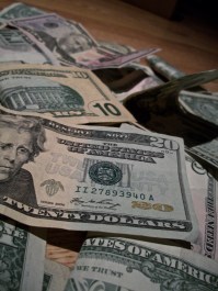 piles_of_money_200991